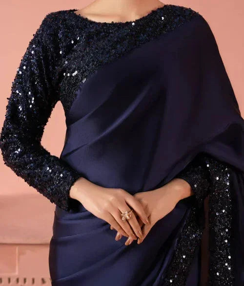 Woman wearing elegant navy blue sequin saree, perfect for formal occasions and parties