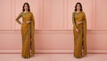 Woman in gold embroidered saree with long-sleeve blouse, Sareeium jan, pink background